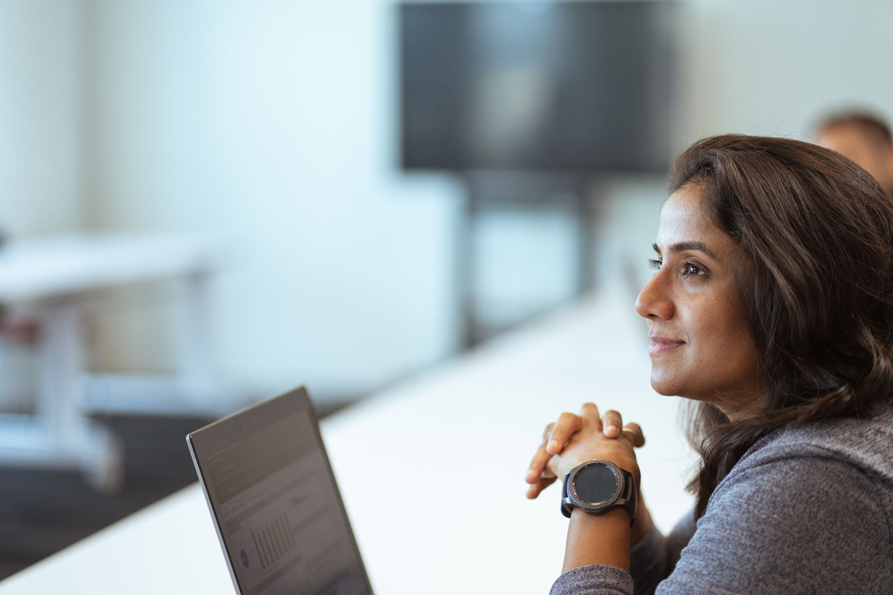 a woman looking at a laptop