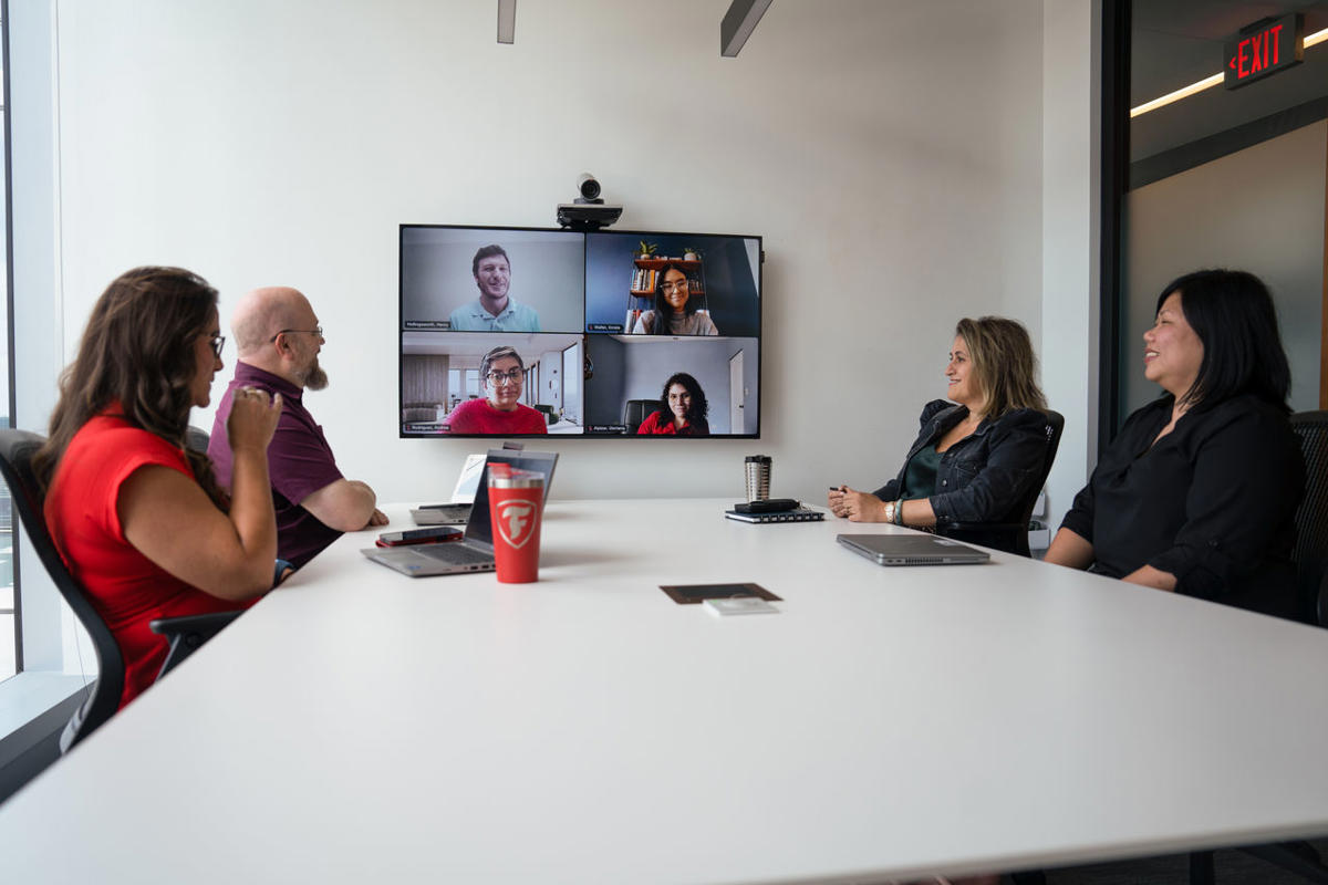 a group of people sitting around a table