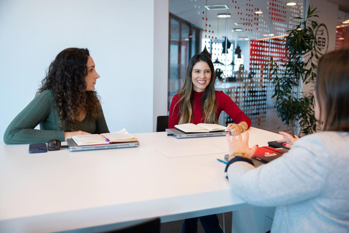 a group of women sitting at a table