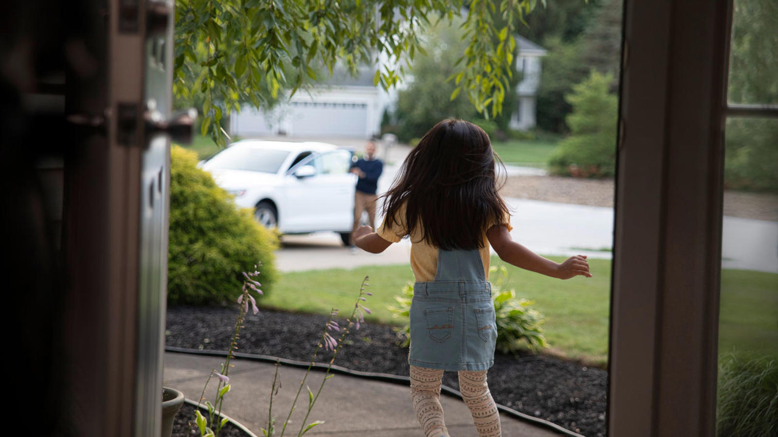 a girl running on a porch