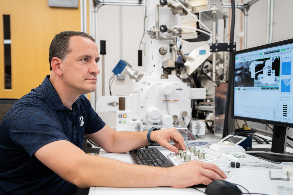 a man sitting at a desk with a computer