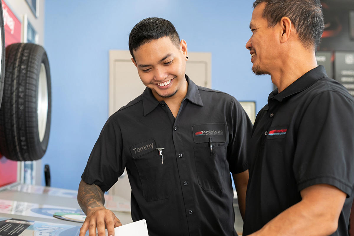 a man smiling at another man