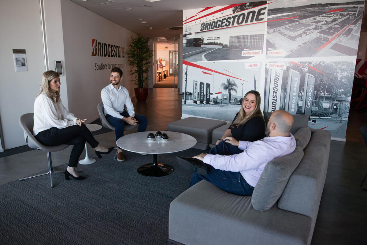 a group of people sitting on couches in a room