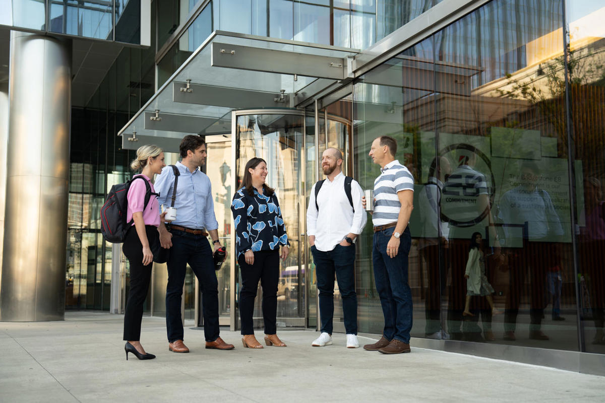 a group of people standing outside a building