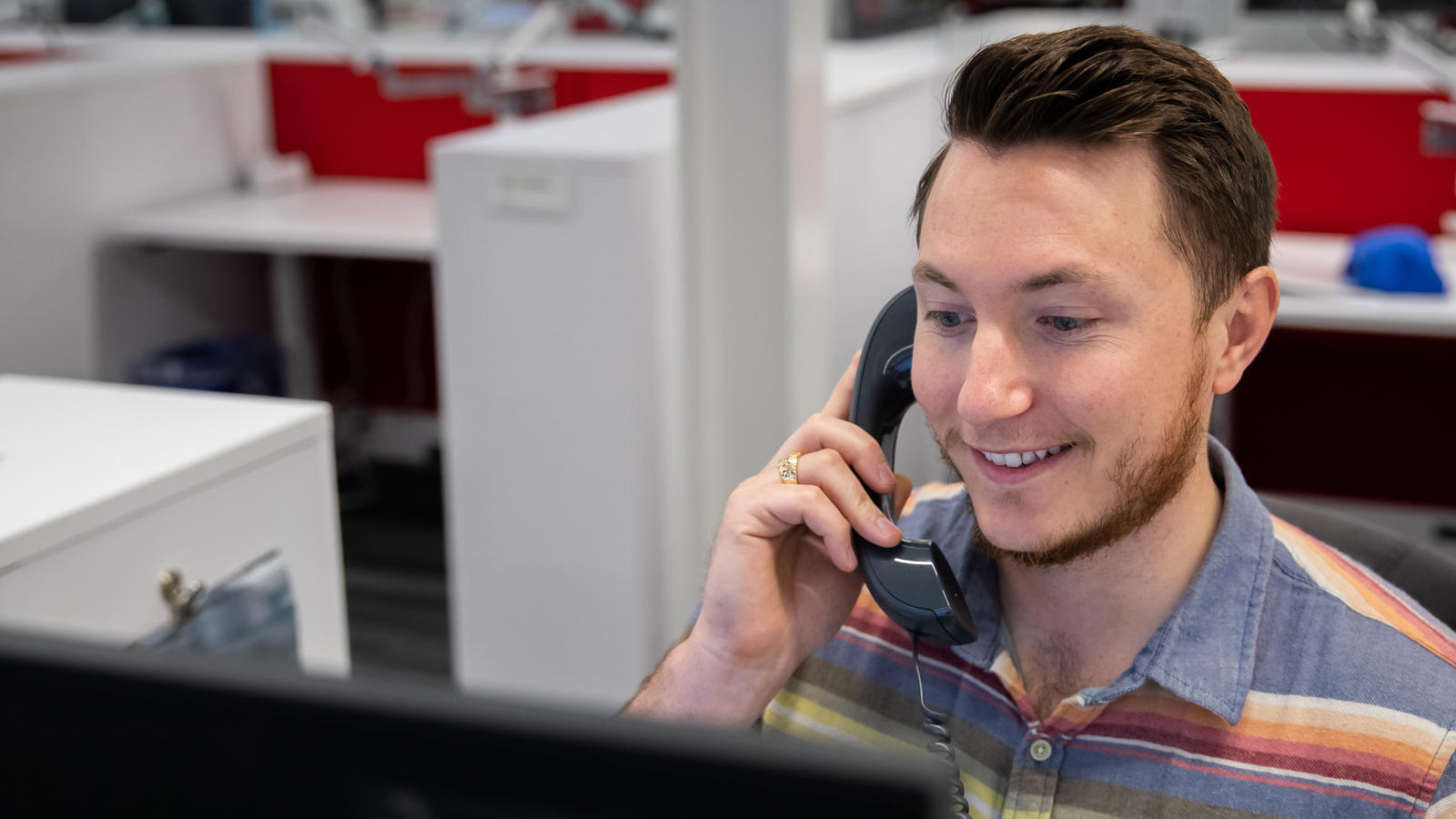 a man holding a phone to his ear