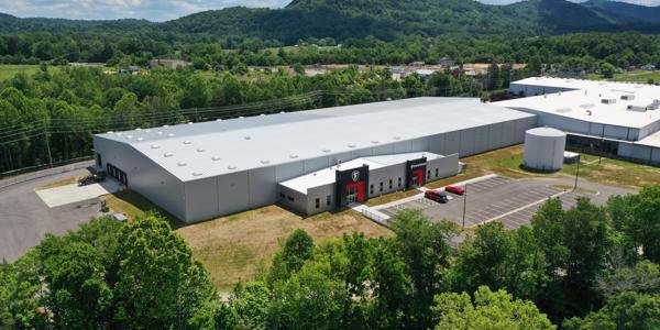 a large building with cars parked in front of it