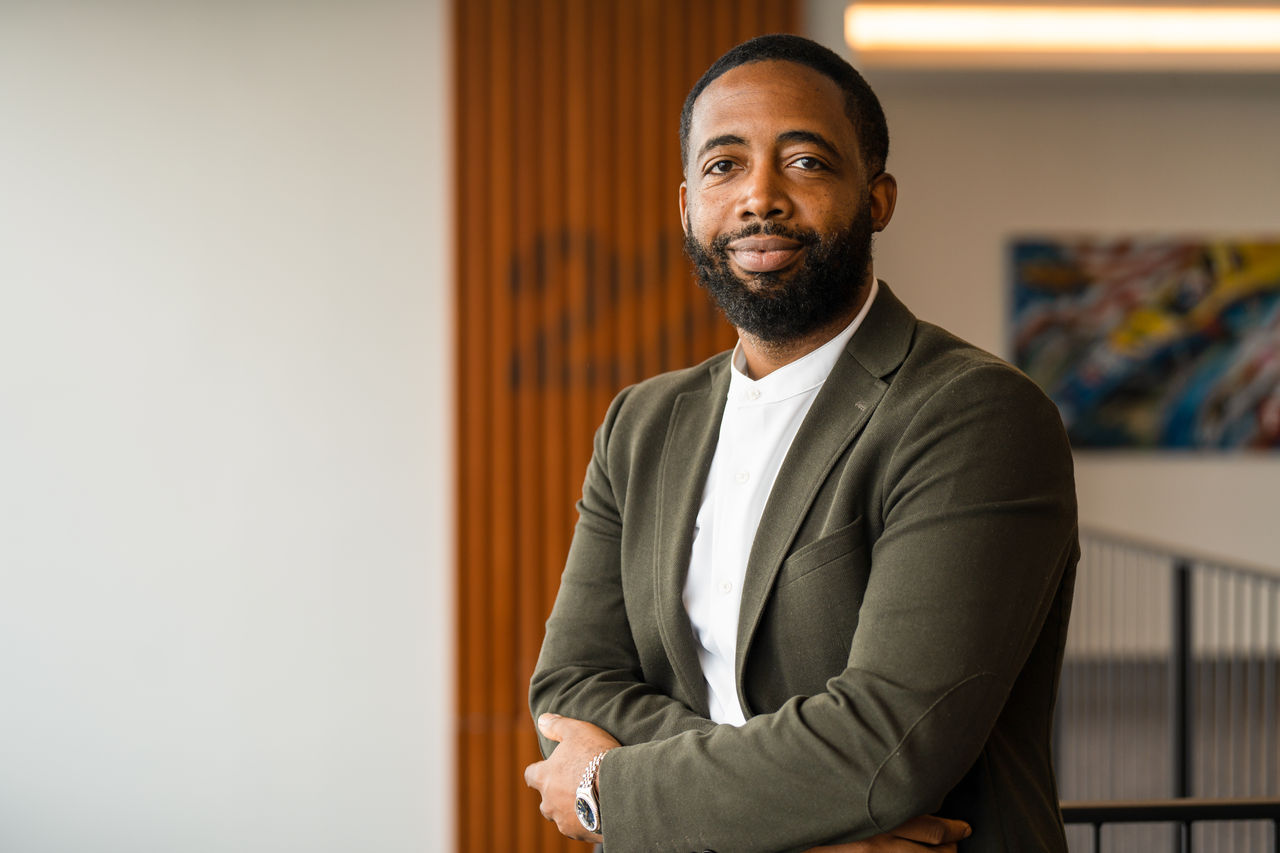 a man with a beard and mustache wearing a suit