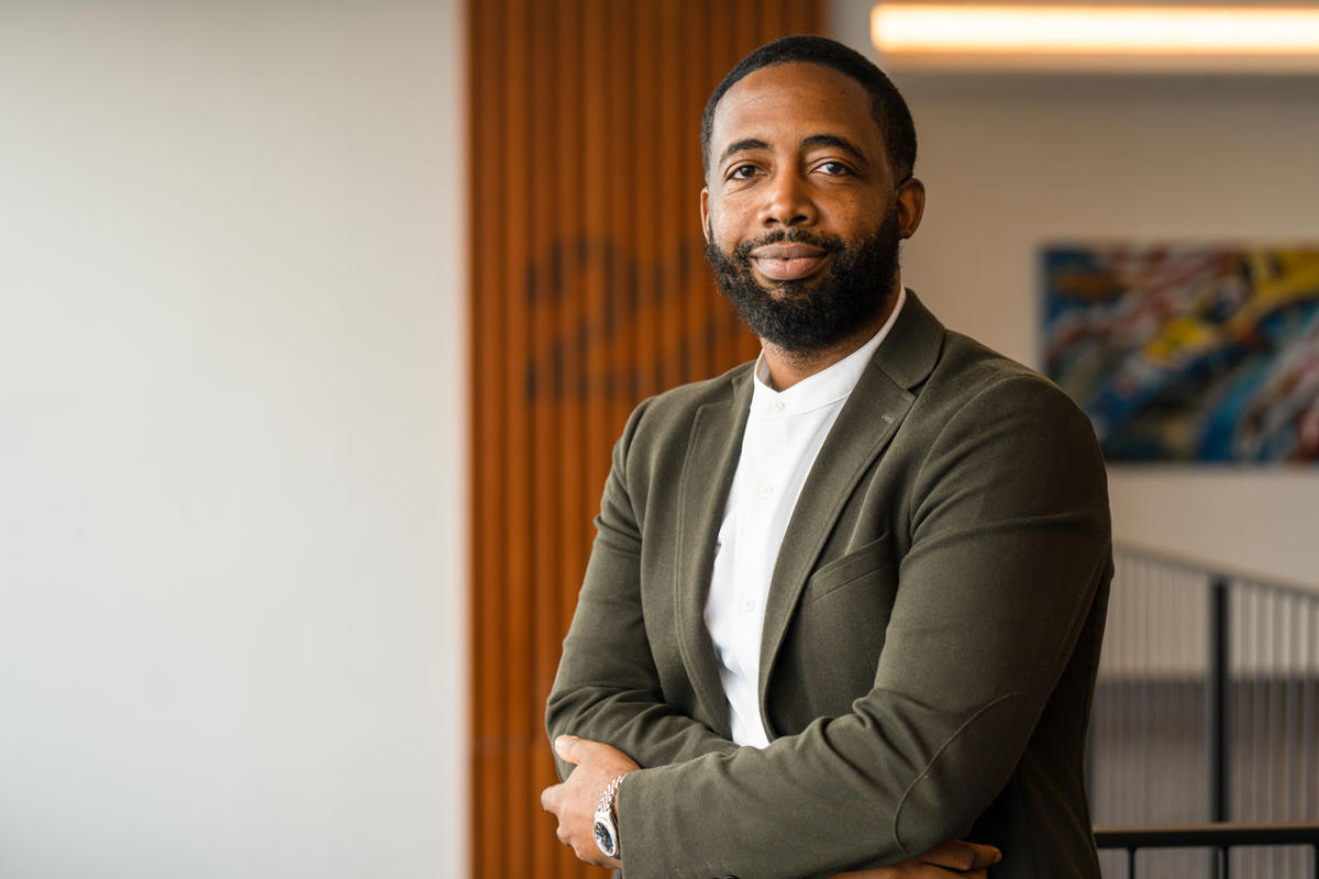 a man with a beard and mustache wearing a suit