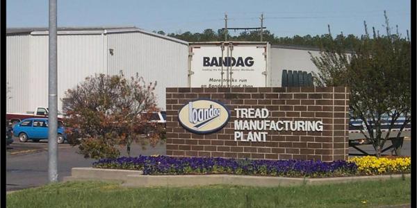 a sign on a brick wall