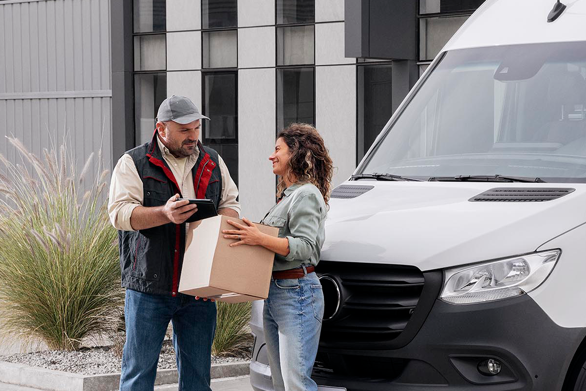 a man and woman holding a box and a box