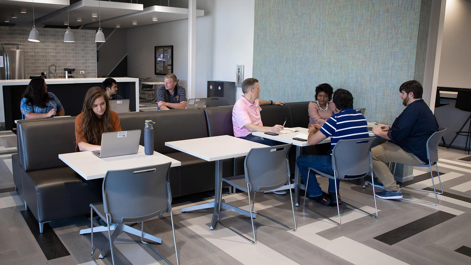 a group of people sitting at tables