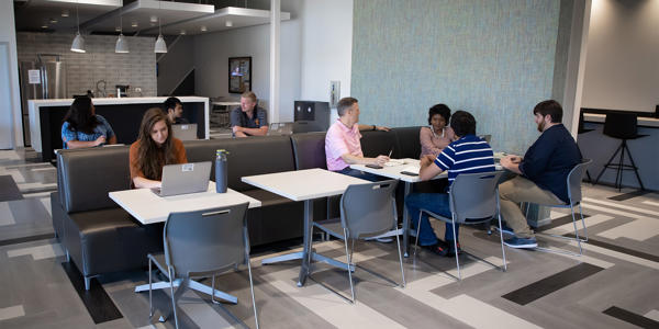 a group of people sitting at tables