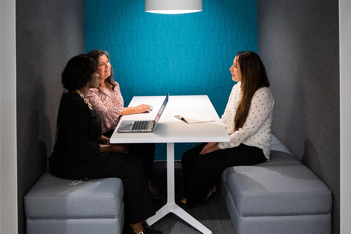 a group of women sitting at a table